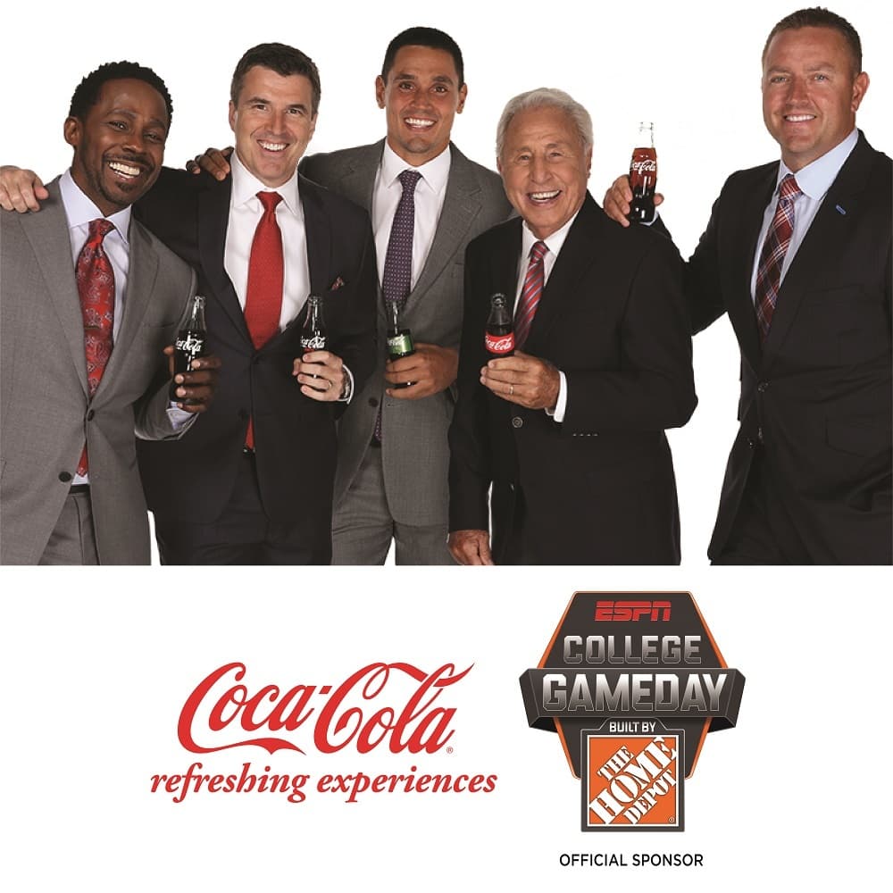 The ESPN College GameDay hosts holding Coca-Cola bottles in a Coca-Cola × College GameDay promo