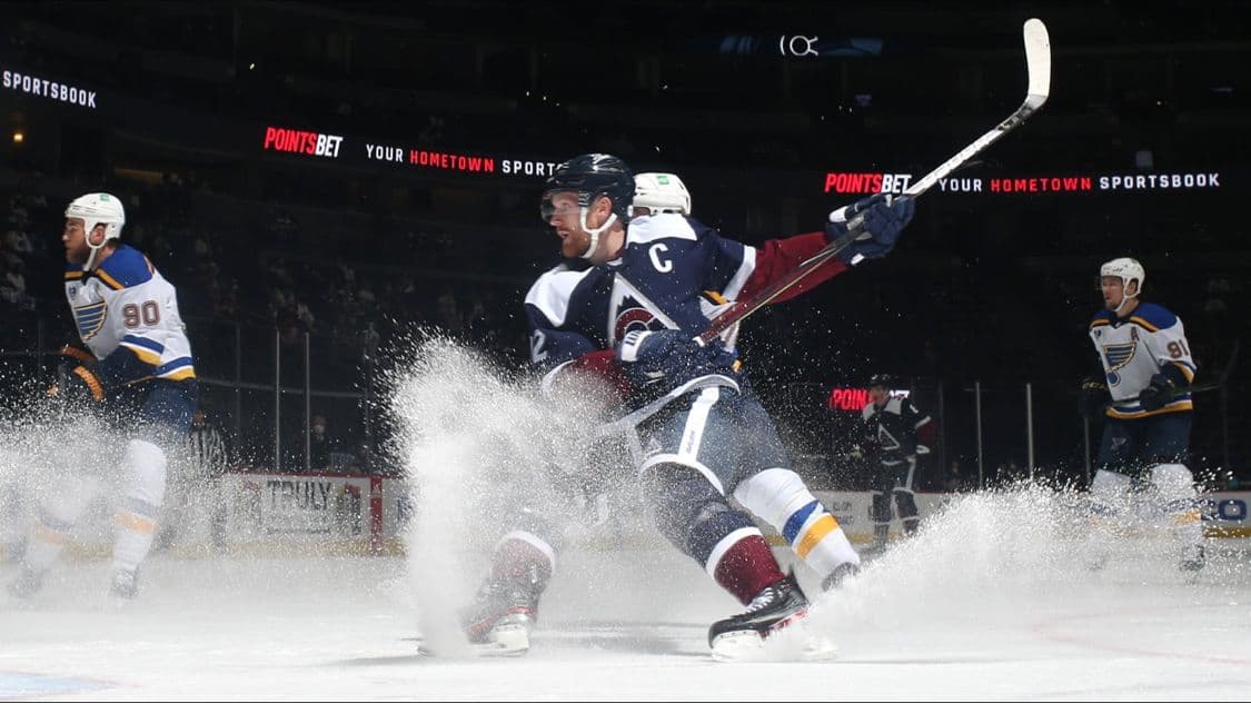 PointsBet "your hometown sportsbook" rink-board signage during an Avalanche–Blues NHL game
